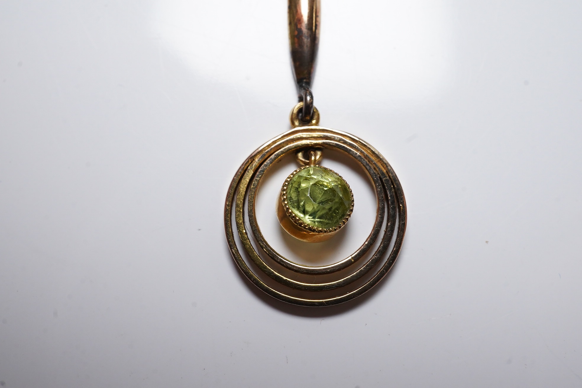 An Edwardian 9ct and peridot set drop pendant necklace, 47cm, gross weight 2.5 grams. Condition - fair to good